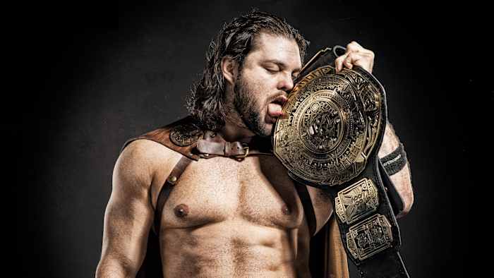 Wrestler Marty “The Moth” Martinez with the Lucha Underground championship